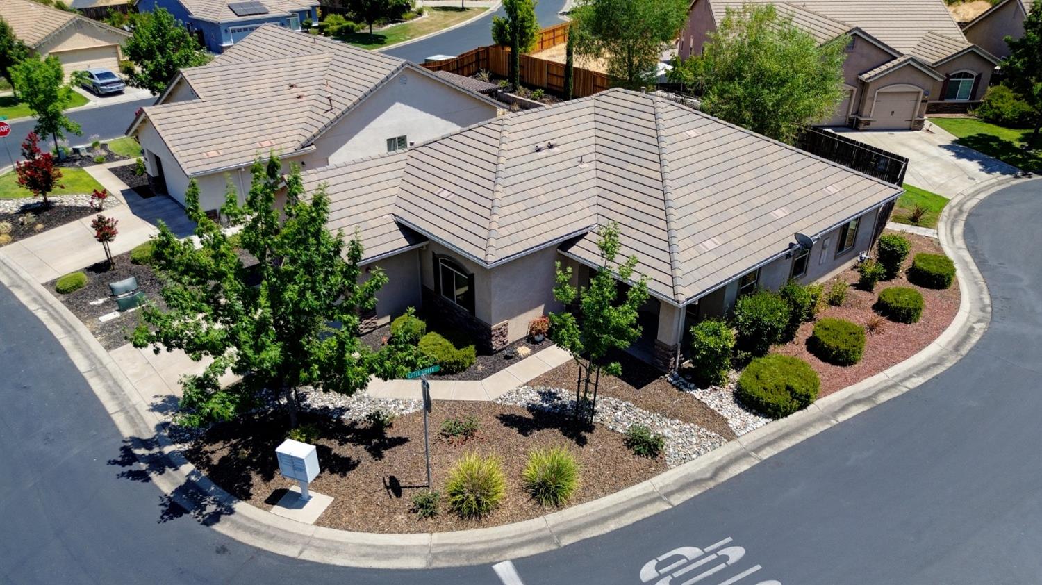 a view of house with swimming pool and outdoor seating