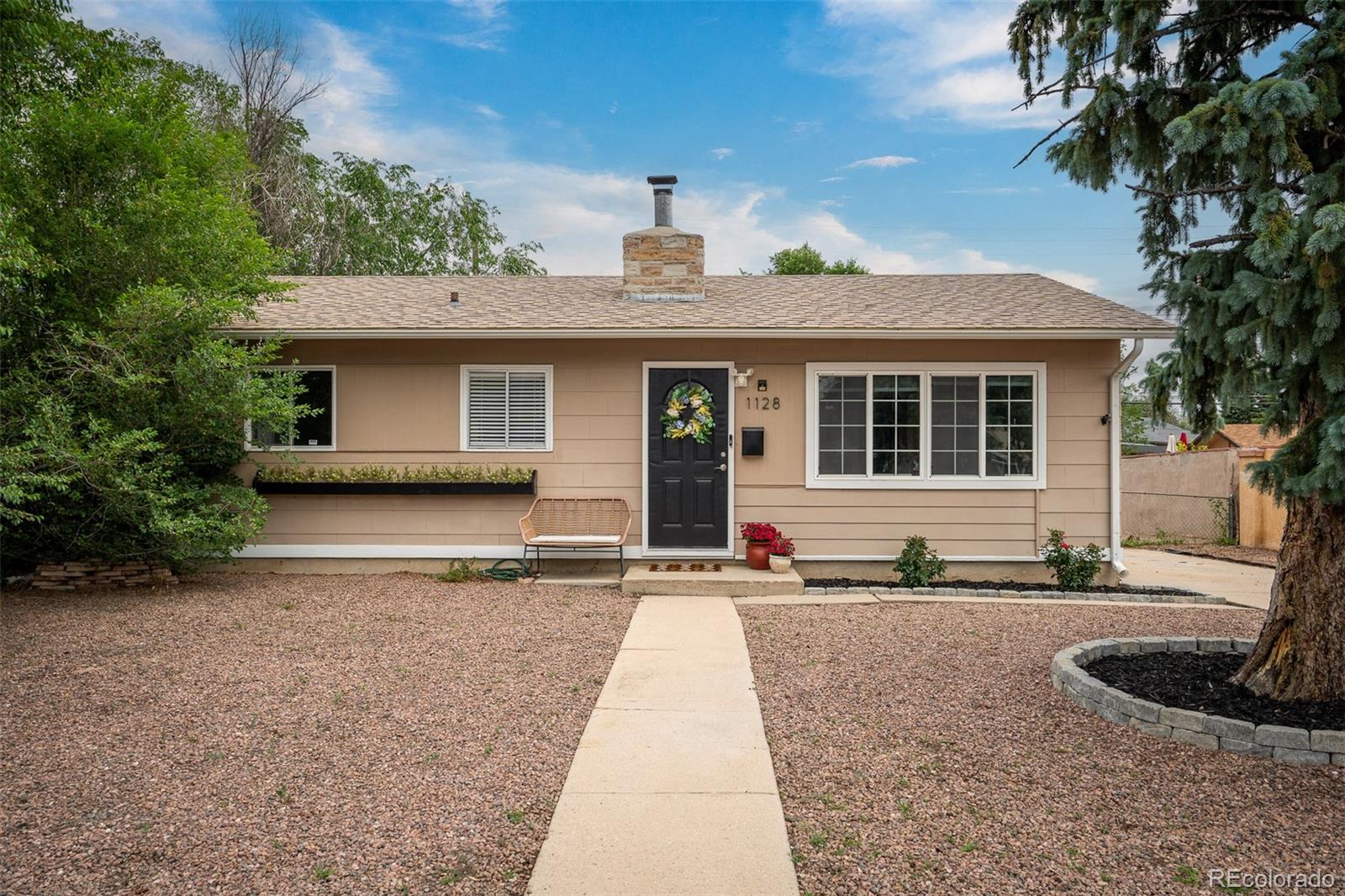 a front view of a house with garage