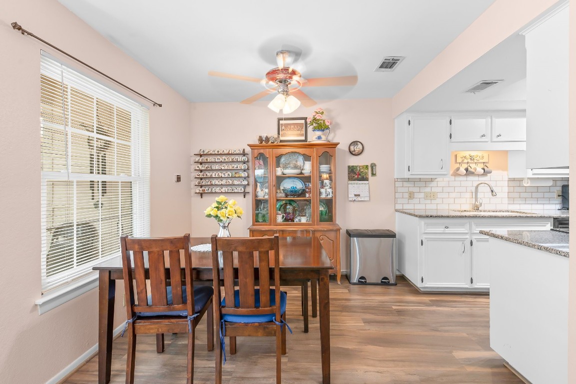 a view of dining room and kitchen with a table chairs a workspace