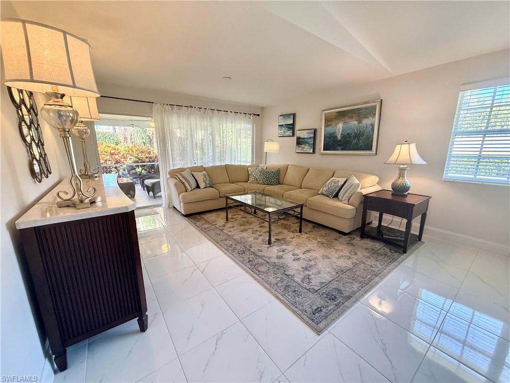 a living room with furniture and a window