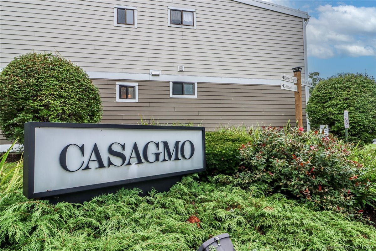 a sign broad in front of a house