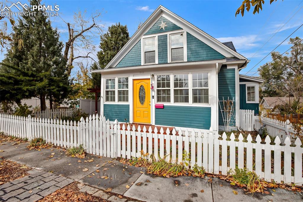 a front view of a house with a small yard