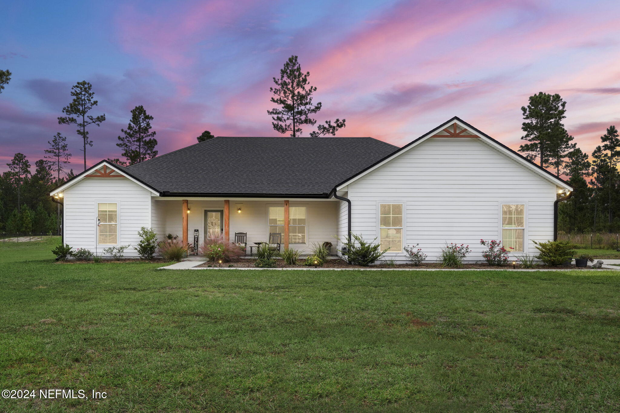 a front view of a house with a yard