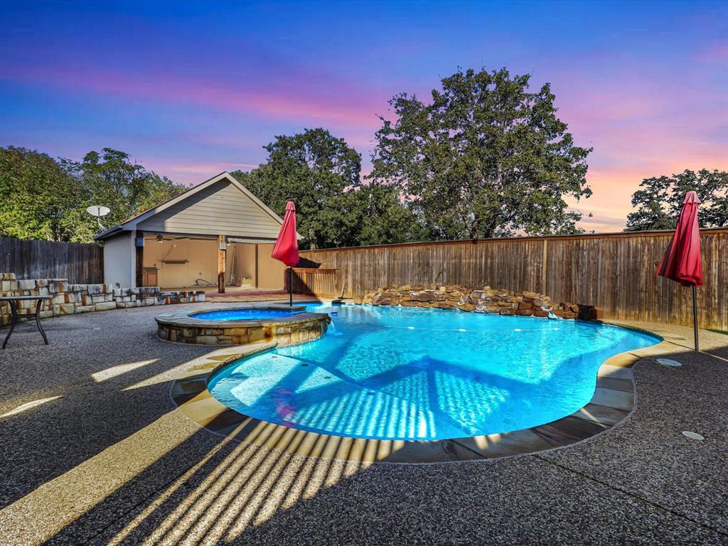 a view of a swimming pool with a lounge chairs