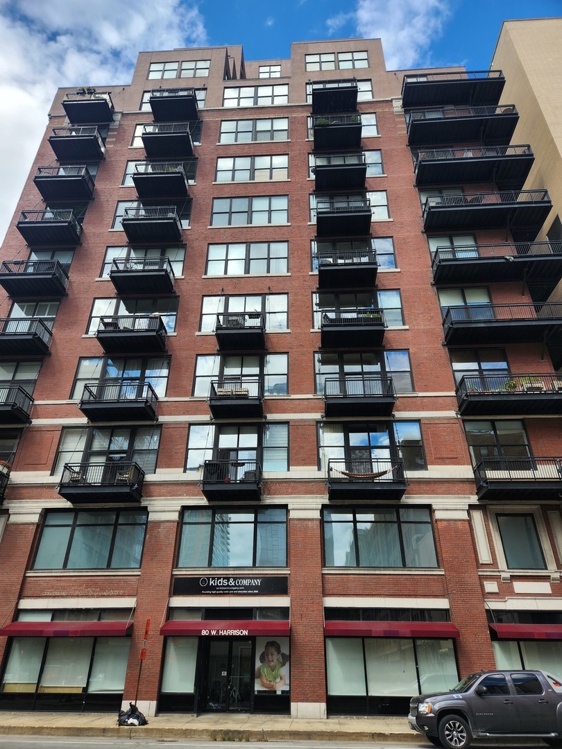 a view of balcony with residential walls and lots of wooden cabinets