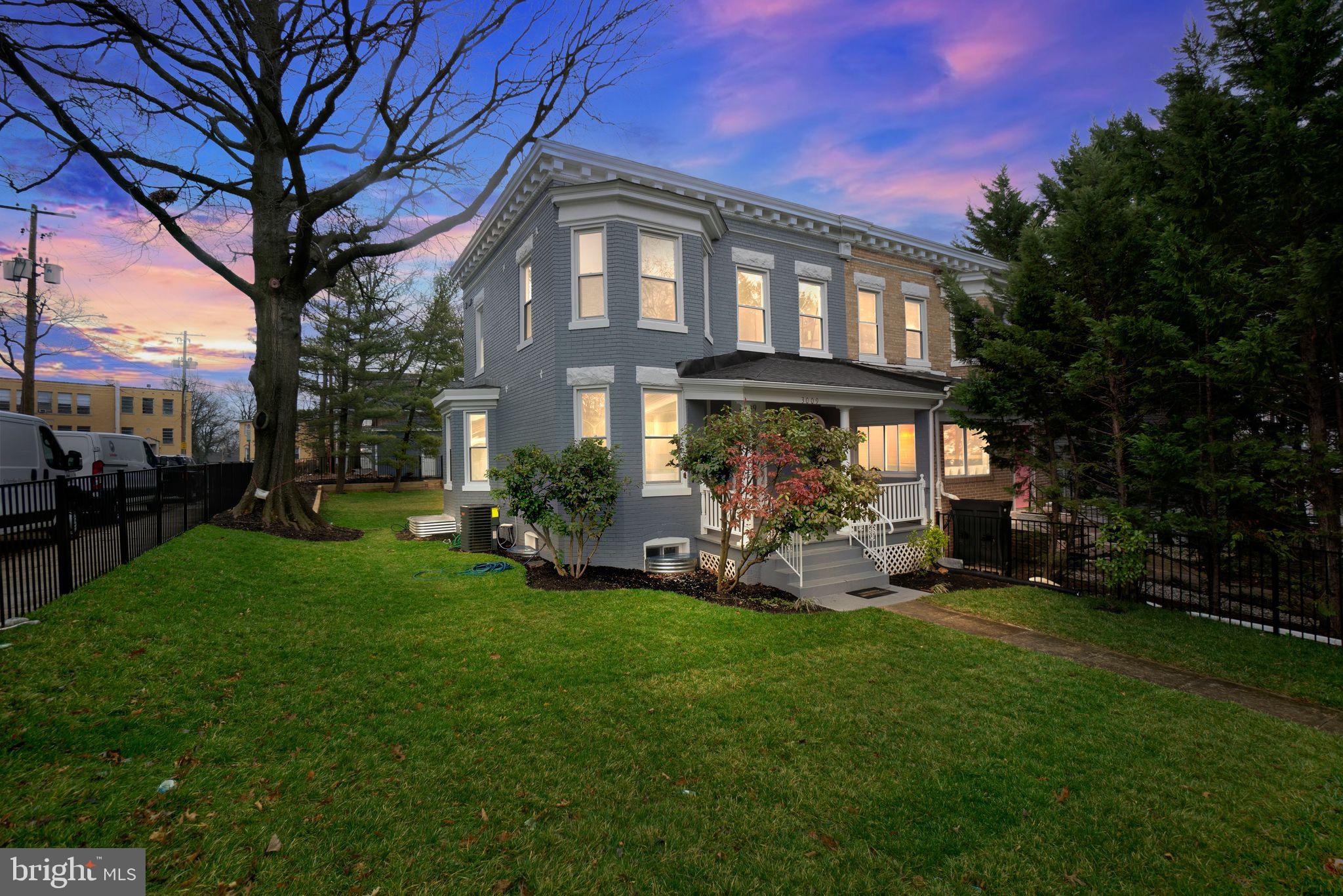 a view of a house with a yard porch and sitting area