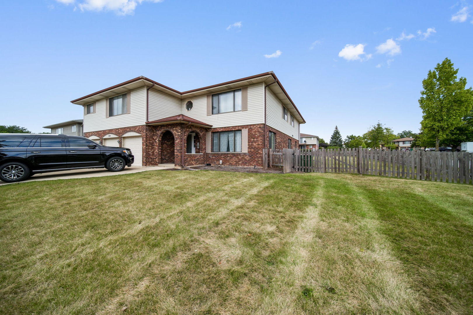 a front view of a house with a yard