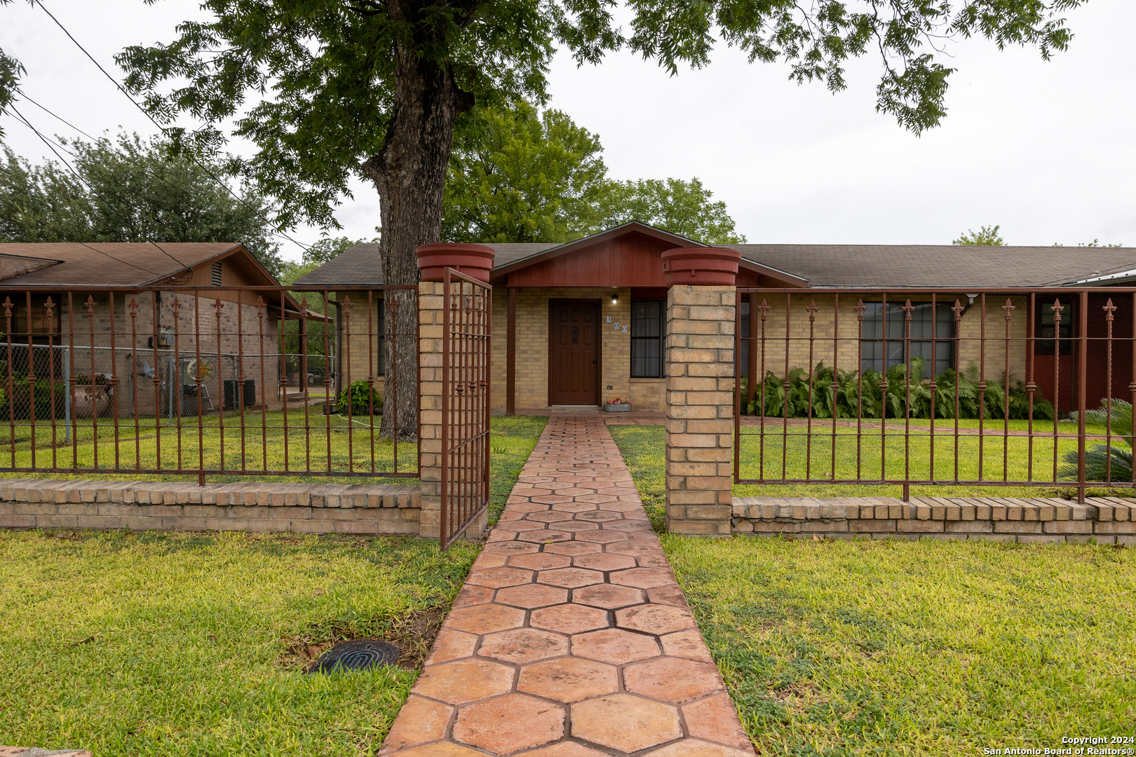 front view of a house with a garden