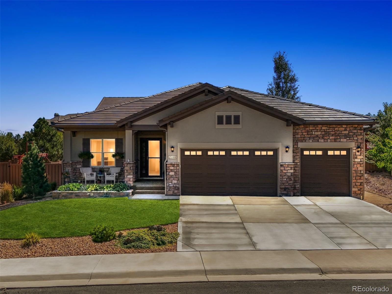 a front view of a house with yard