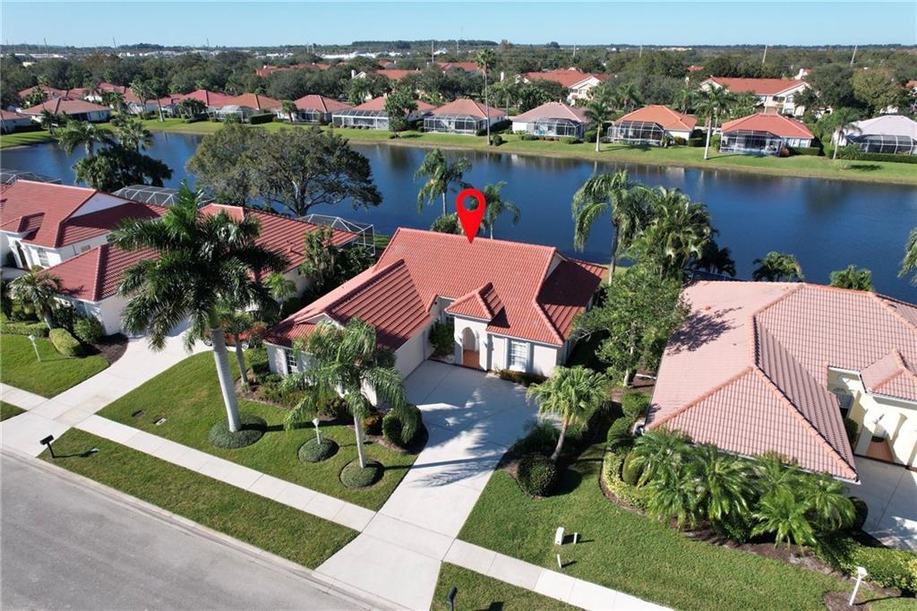 an aerial view of a house with a lake view