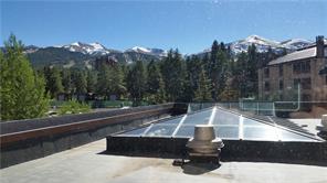 a view of a swimming pool with a yard