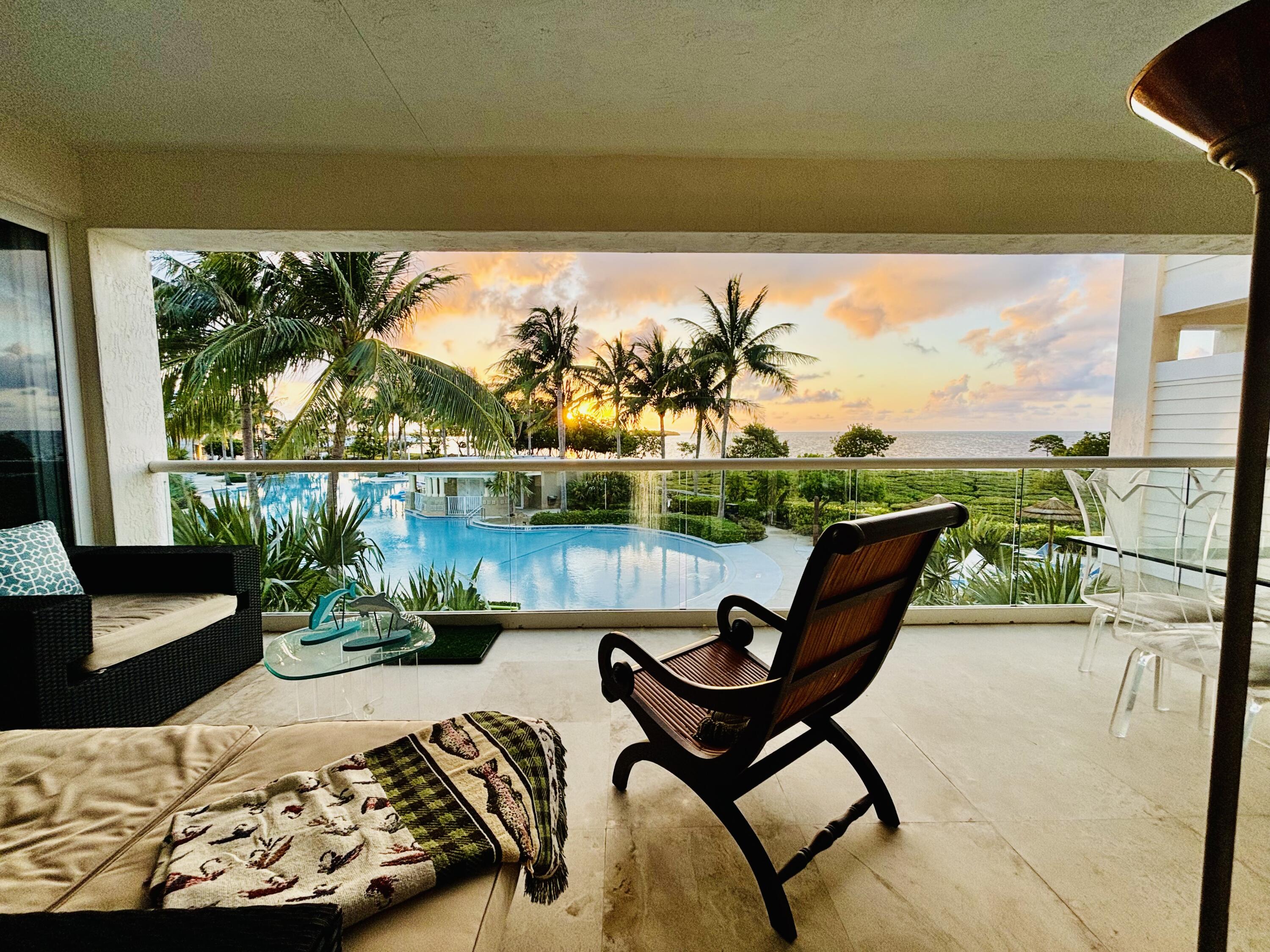 a view of a chairs and table in patio