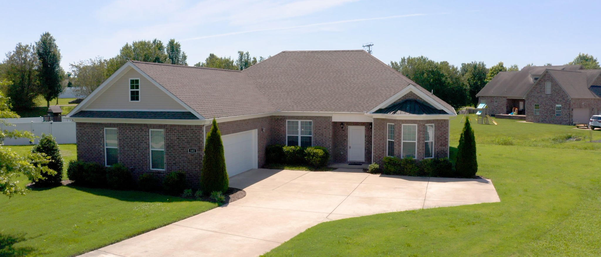 a front view of a house with garden