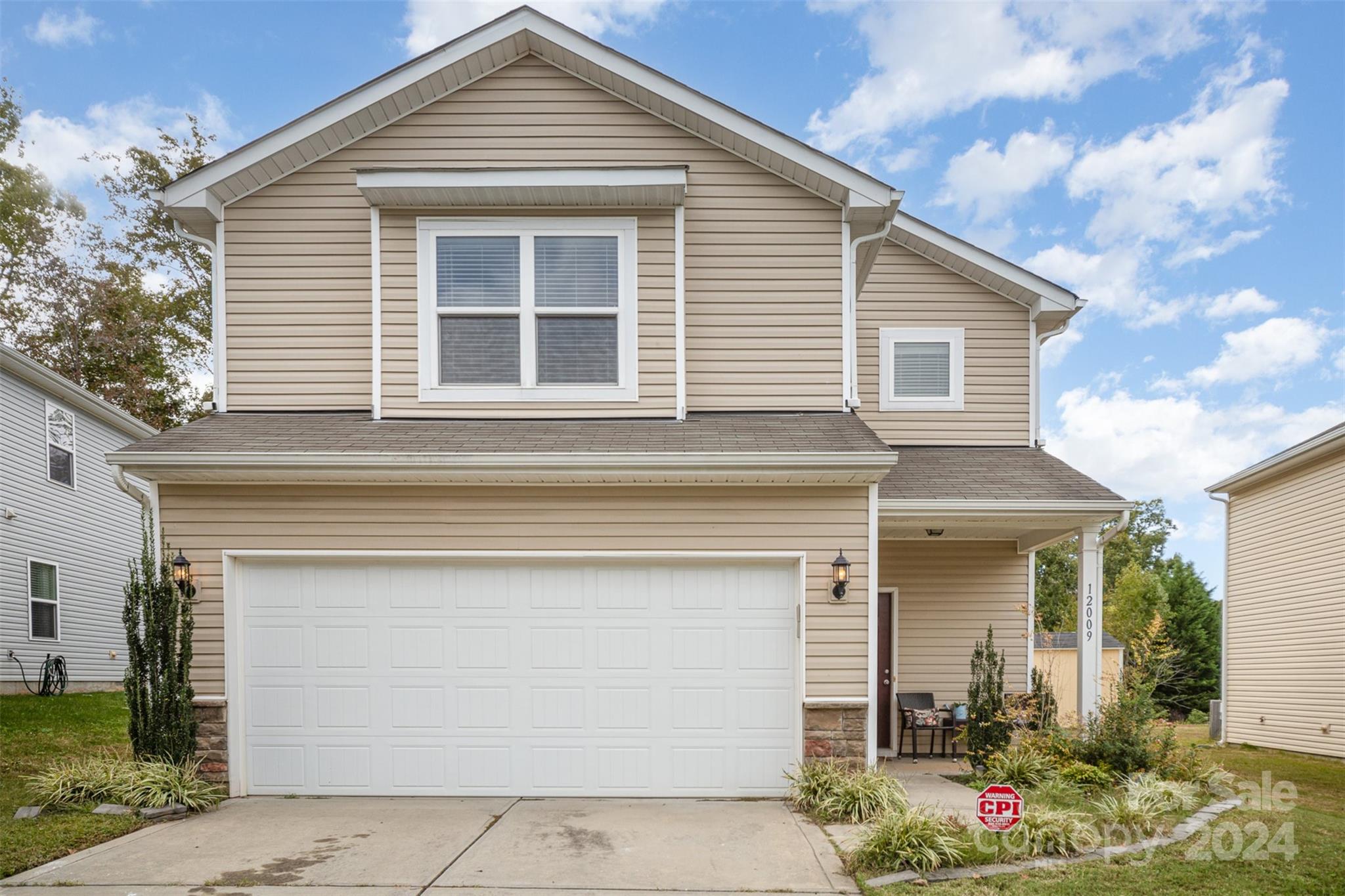 a front view of a house with yard