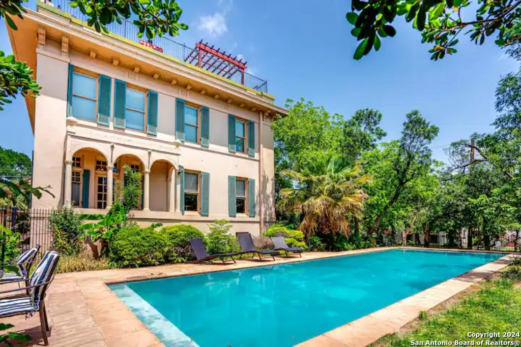 a front view of a house with swimming pool