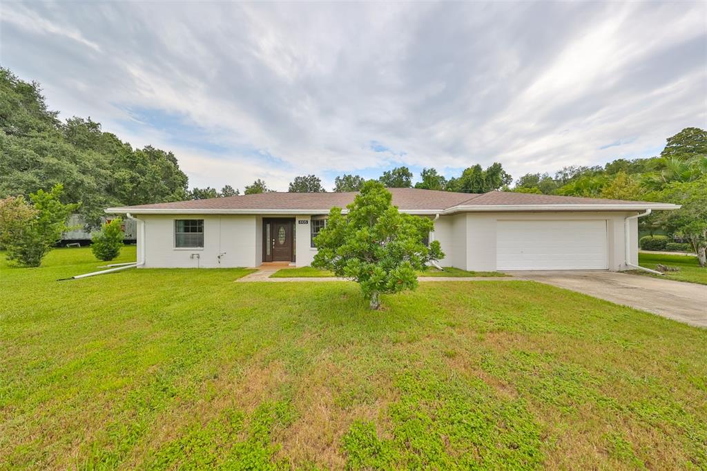 front view of a house with a big yard