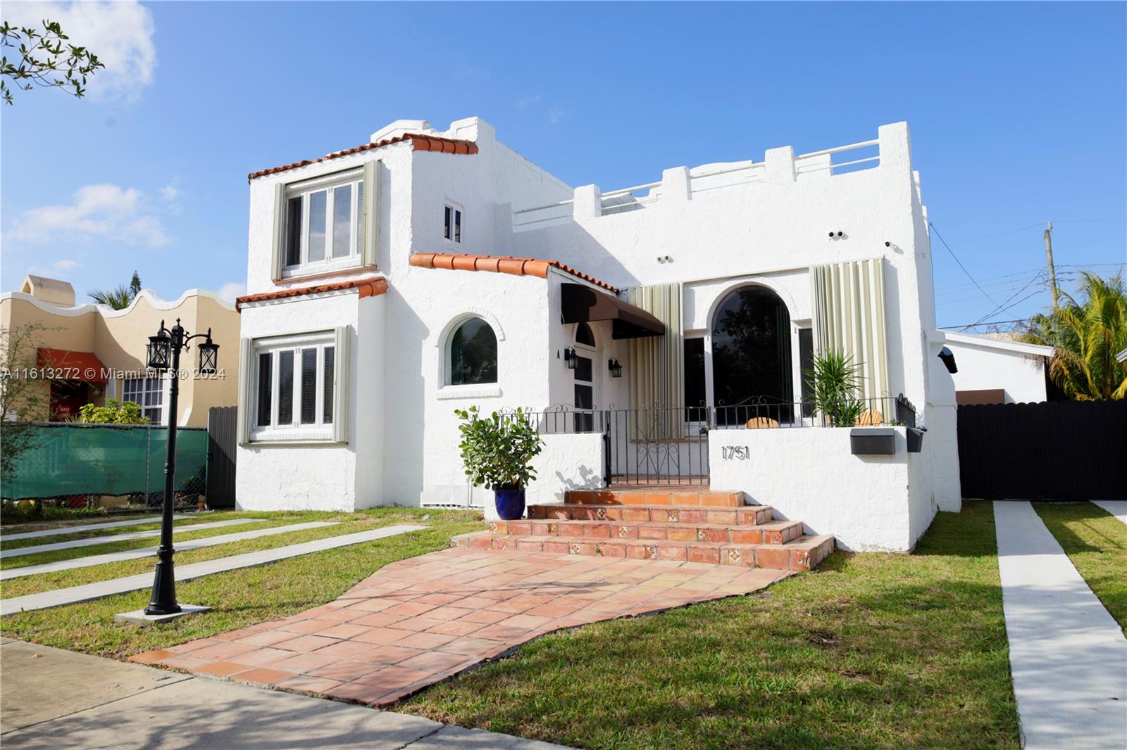 a front view of a house with a porch