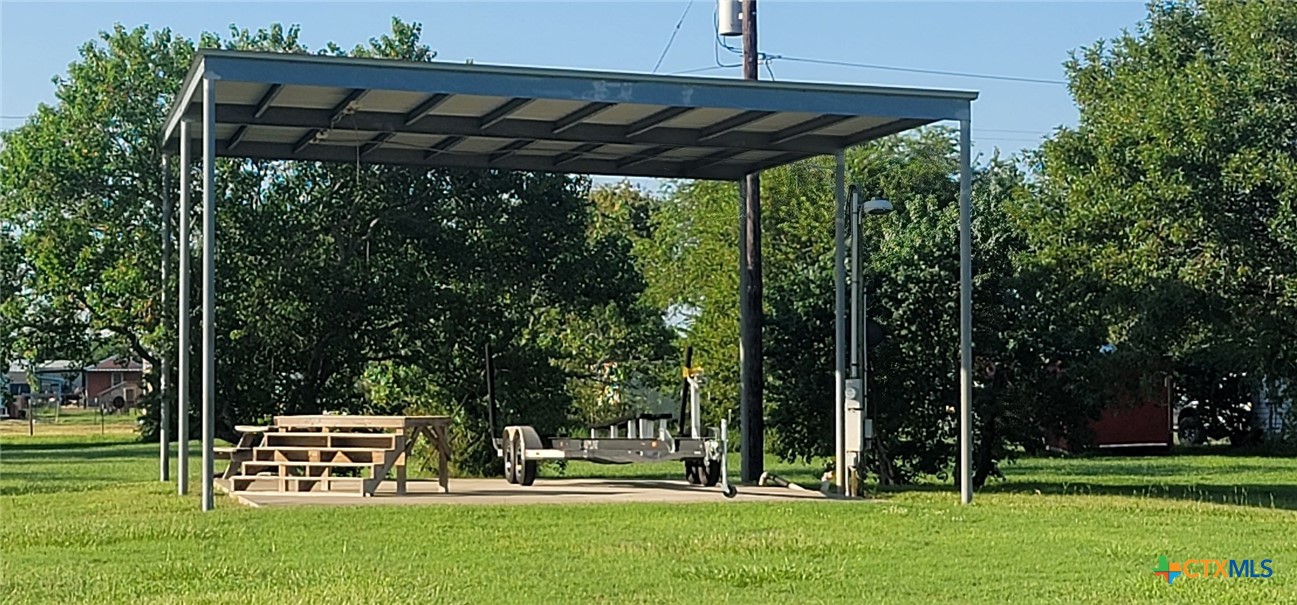 a view of a park with large trees