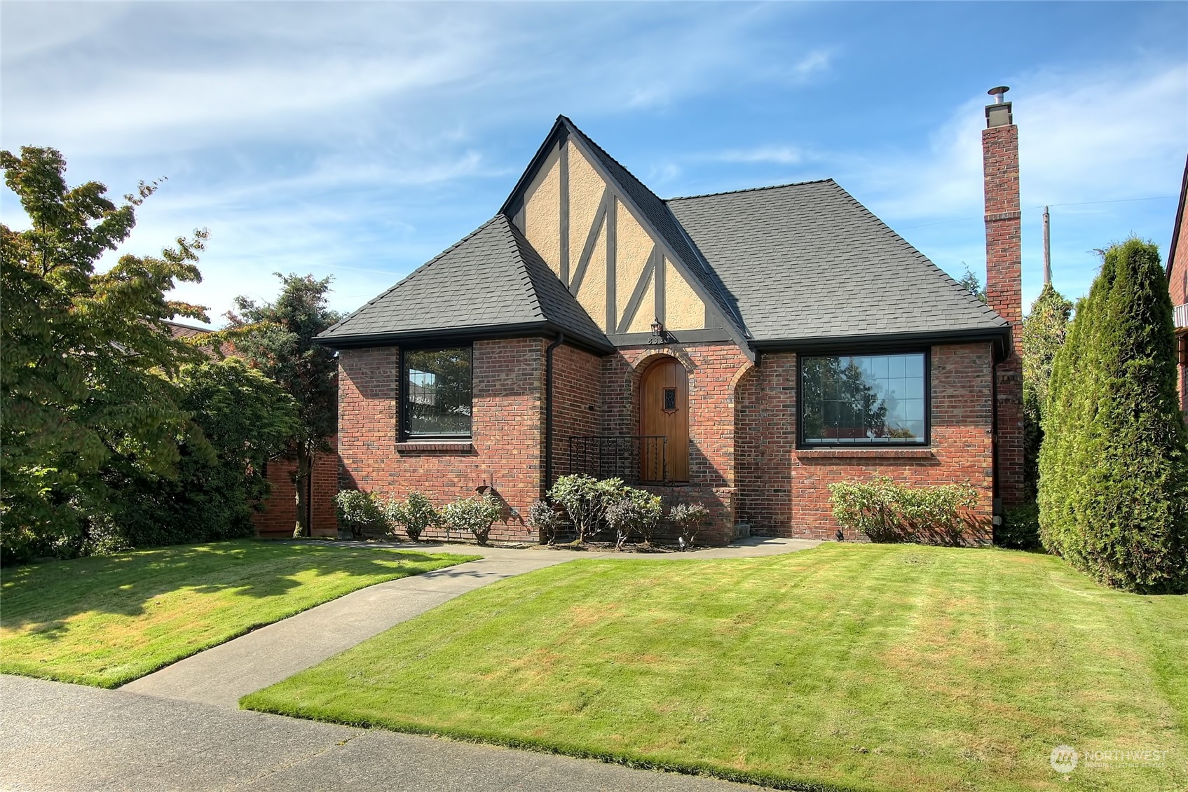 a front view of a house with garden