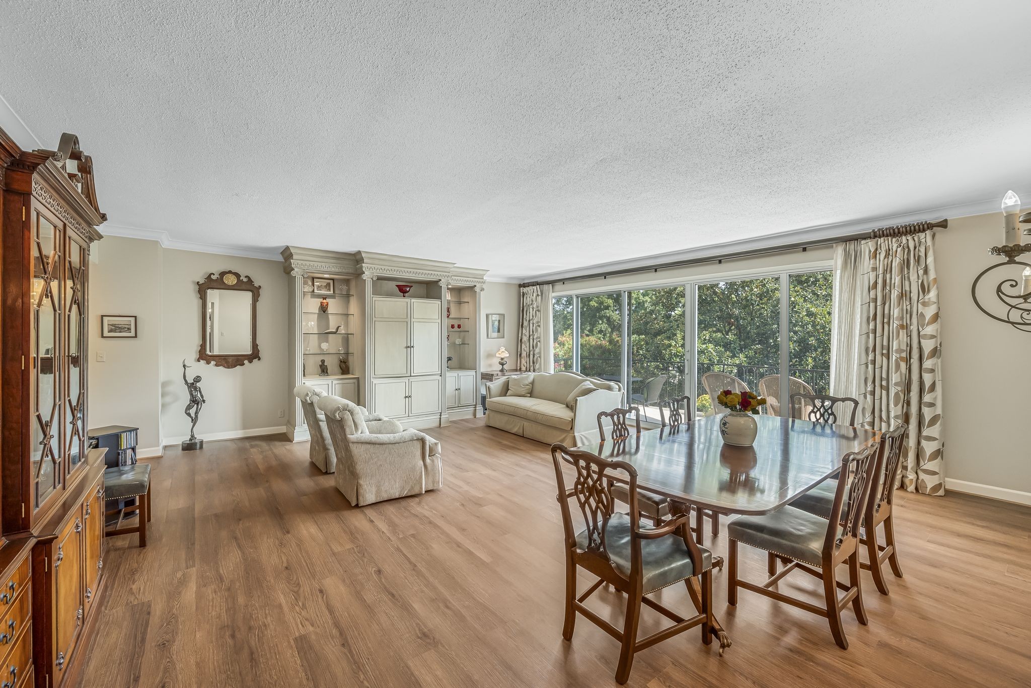 a view of a dining room with furniture window and wooden floor