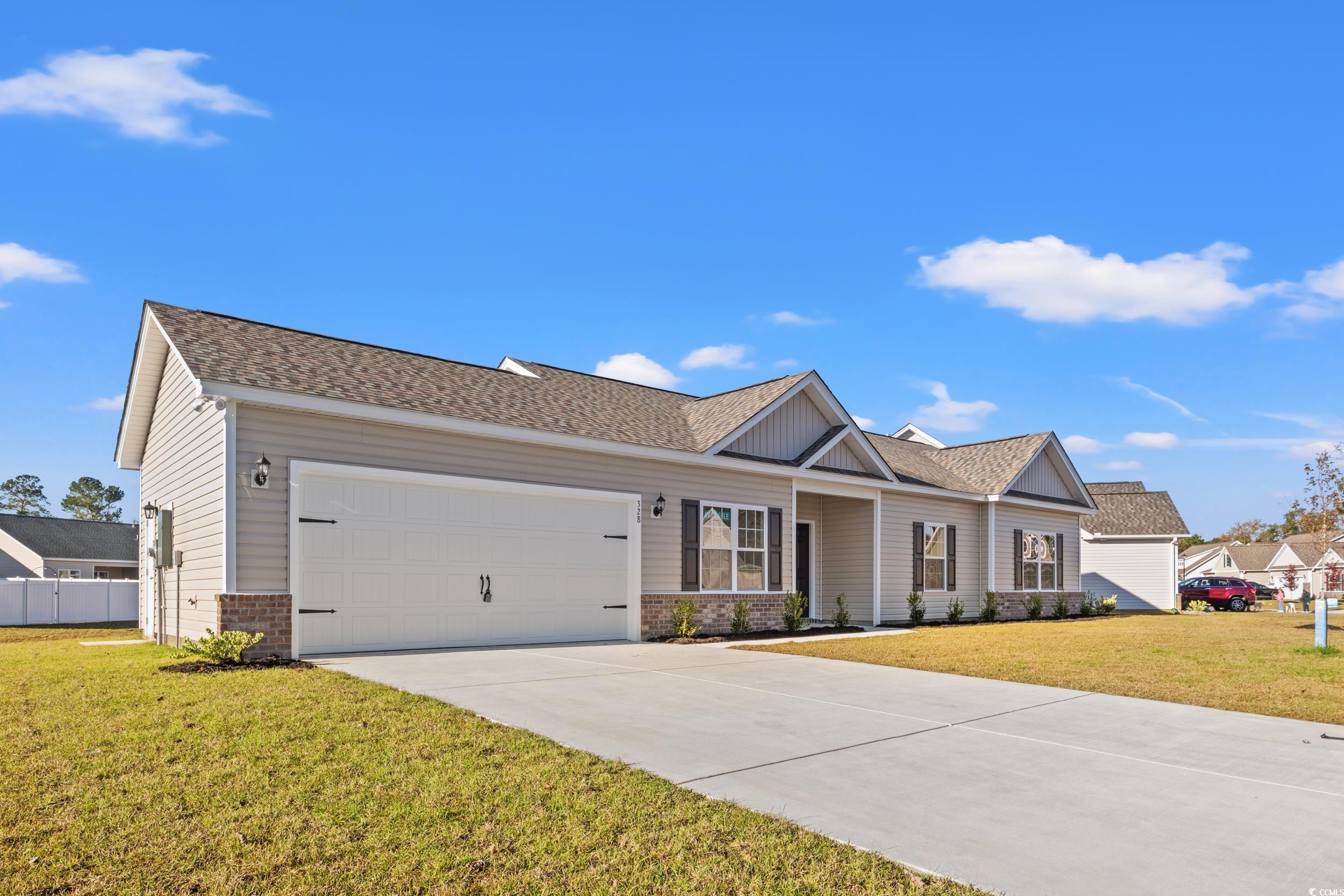 View of front of home featuring a front lawn and a