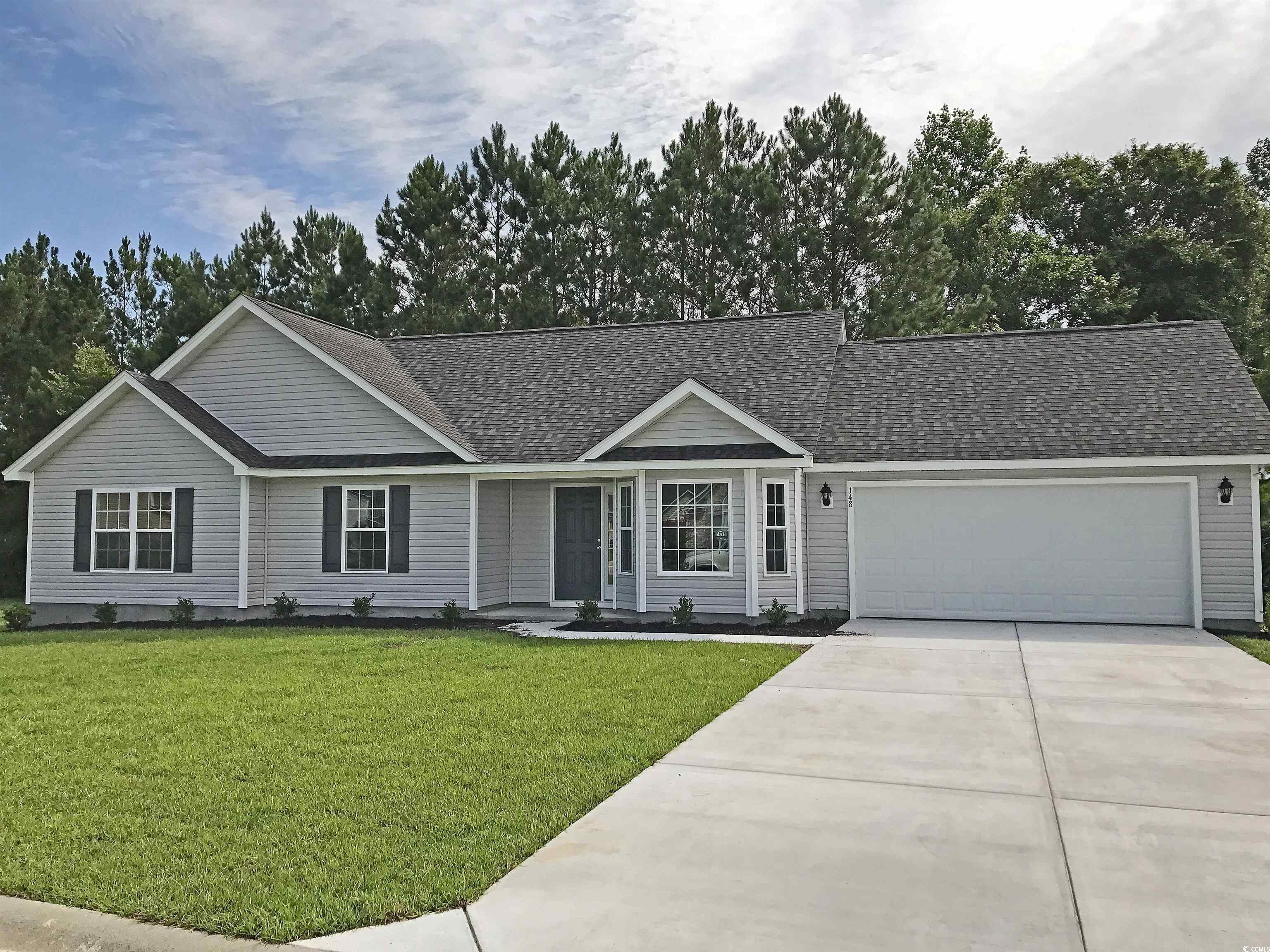 Ranch-style home with a garage and a front yard