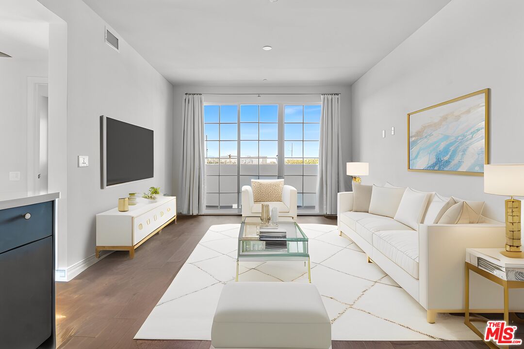 a living room with furniture fireplace and a flat screen tv