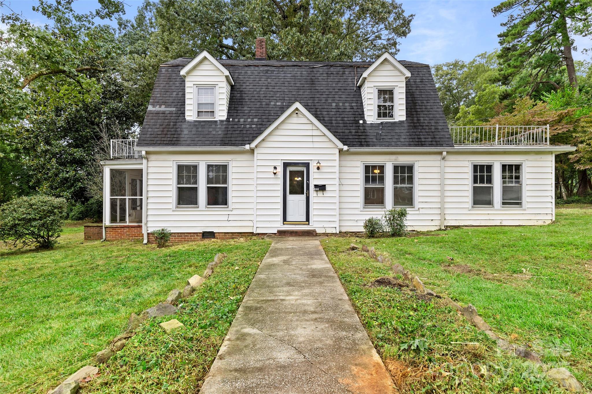 a front view of a house with yard