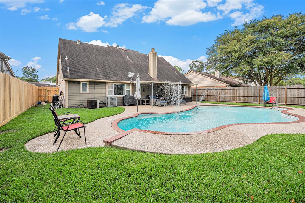 a view of a house with a yard porch and sitting area