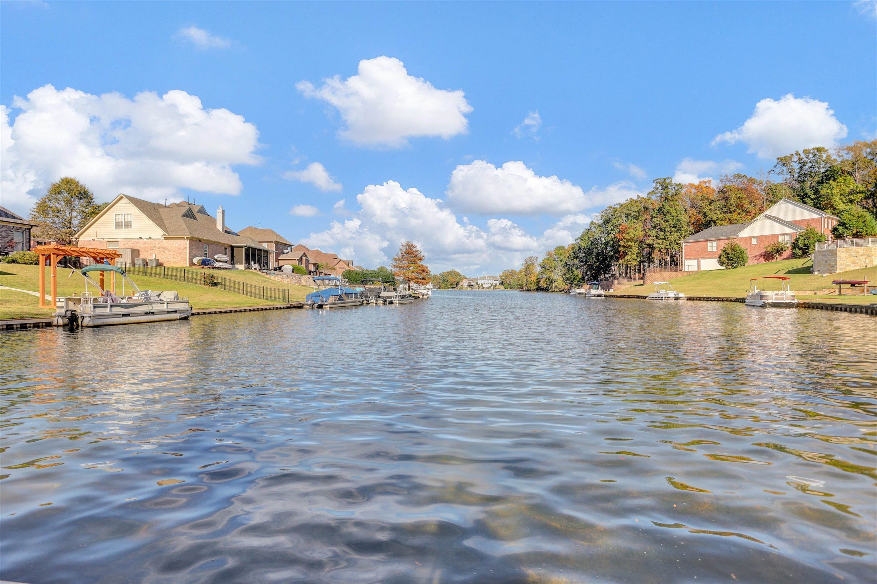 Property view of water featuring a boat dock