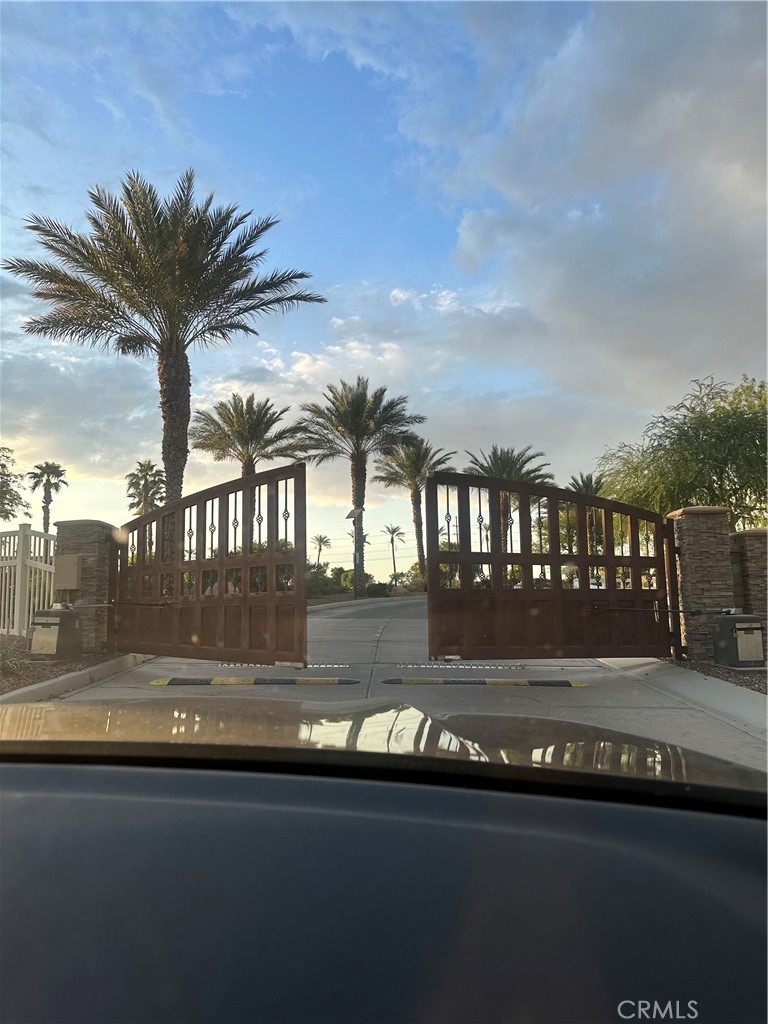 a view of swimming pool with outdoor seating and yard in back