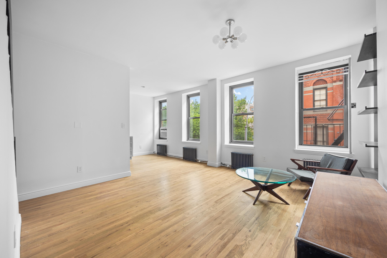 a living room with furniture and next to a window