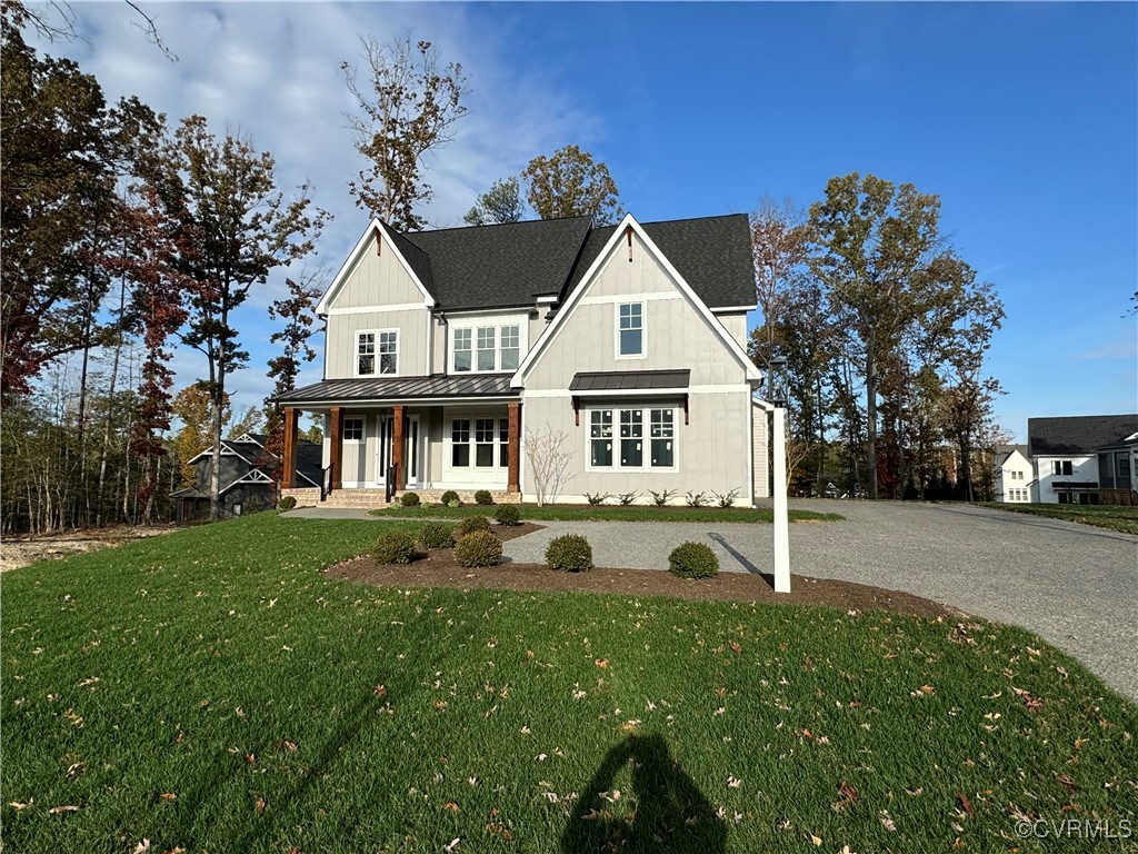 a view of a house with backyard and a garden