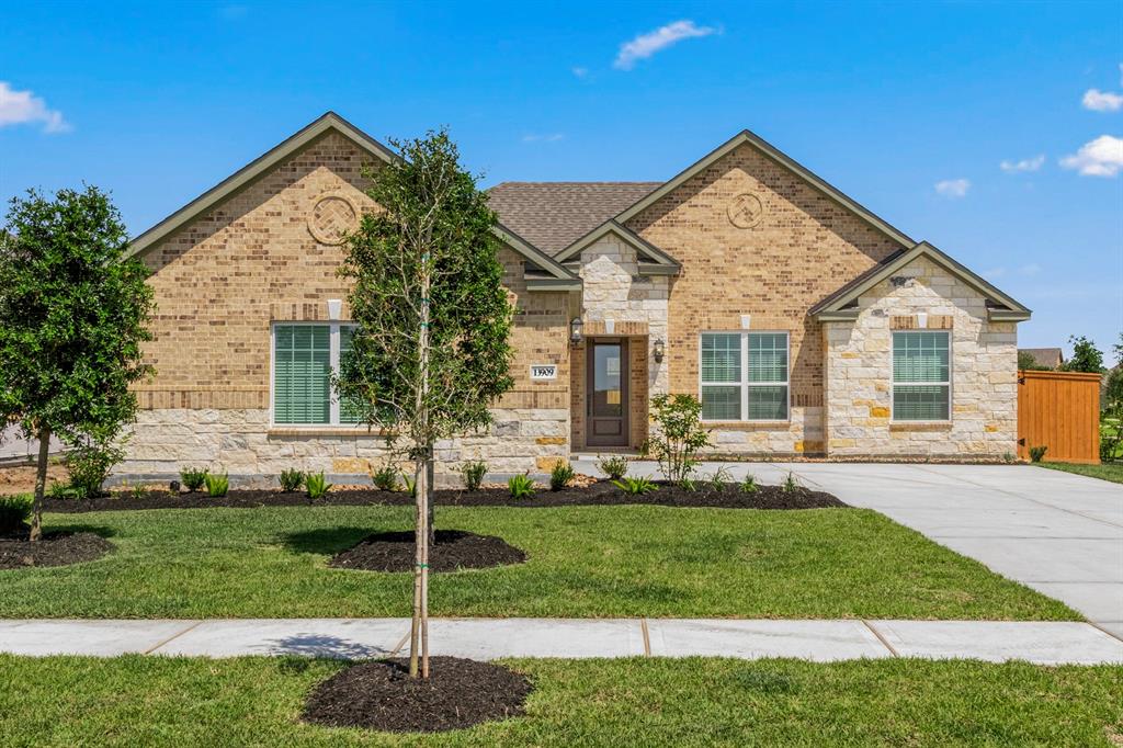 The Ironwood Plan by LGI Homes features 3 bedrooms, 2 bathrooms, and has beautiful curb appeal. Completed example being built at 3202 Bolt Rope Drive. Actual home does not have a stone front, only brick.