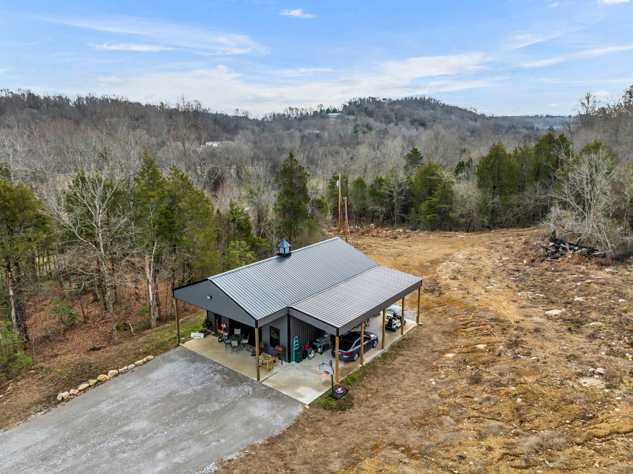 a view of a big house with a mountain in the background