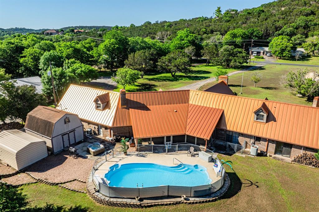 a view of a swimming pool with a patio