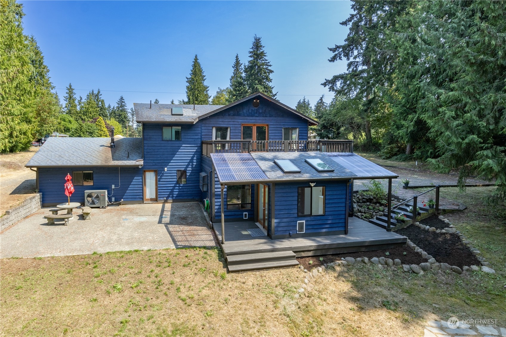 a view of a house with a sink and wooden fence