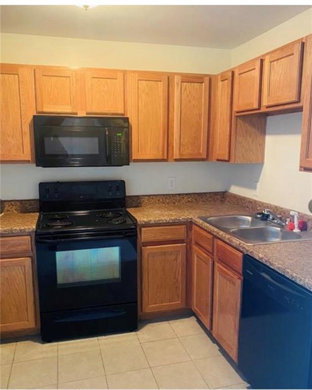 a kitchen with a stove and a microwave