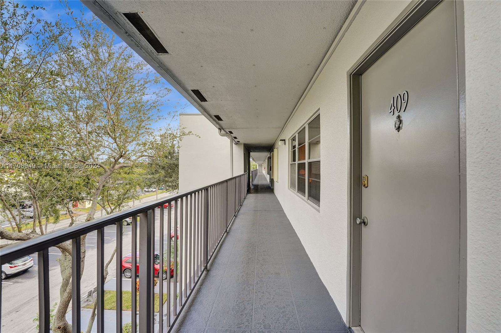 a view of a balcony with wooden floor