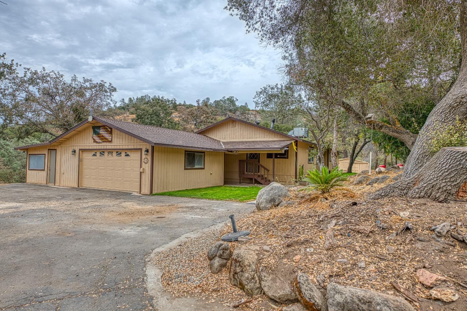 a front view of a house with a yard and garage