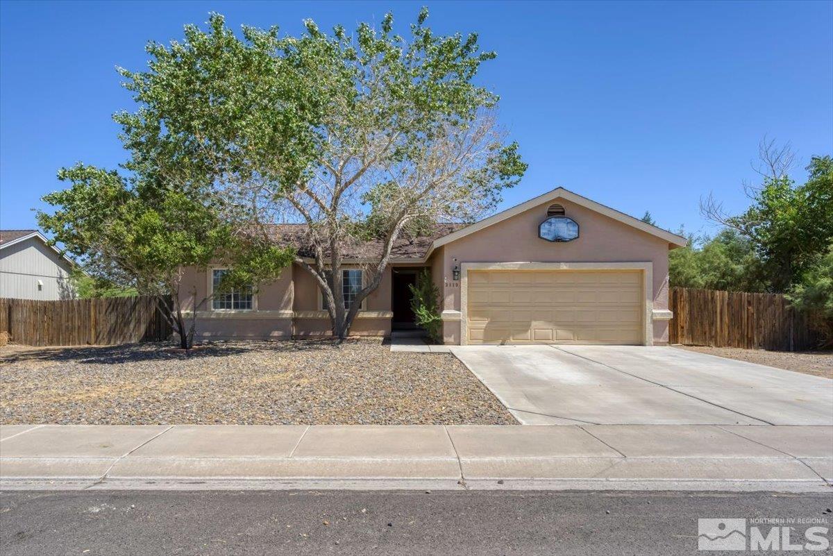 a house with a tree in front of it