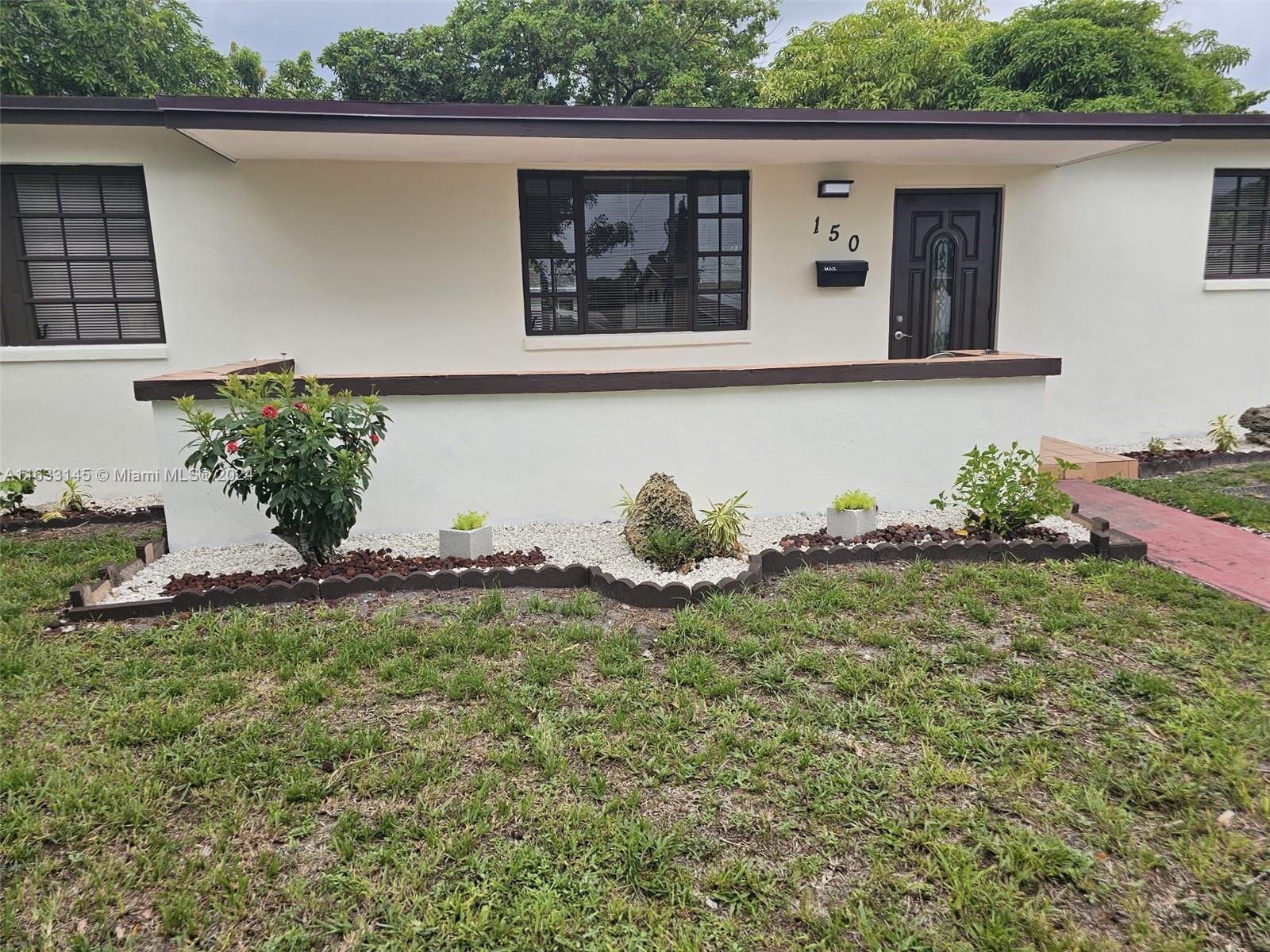 a view of a house with a garden