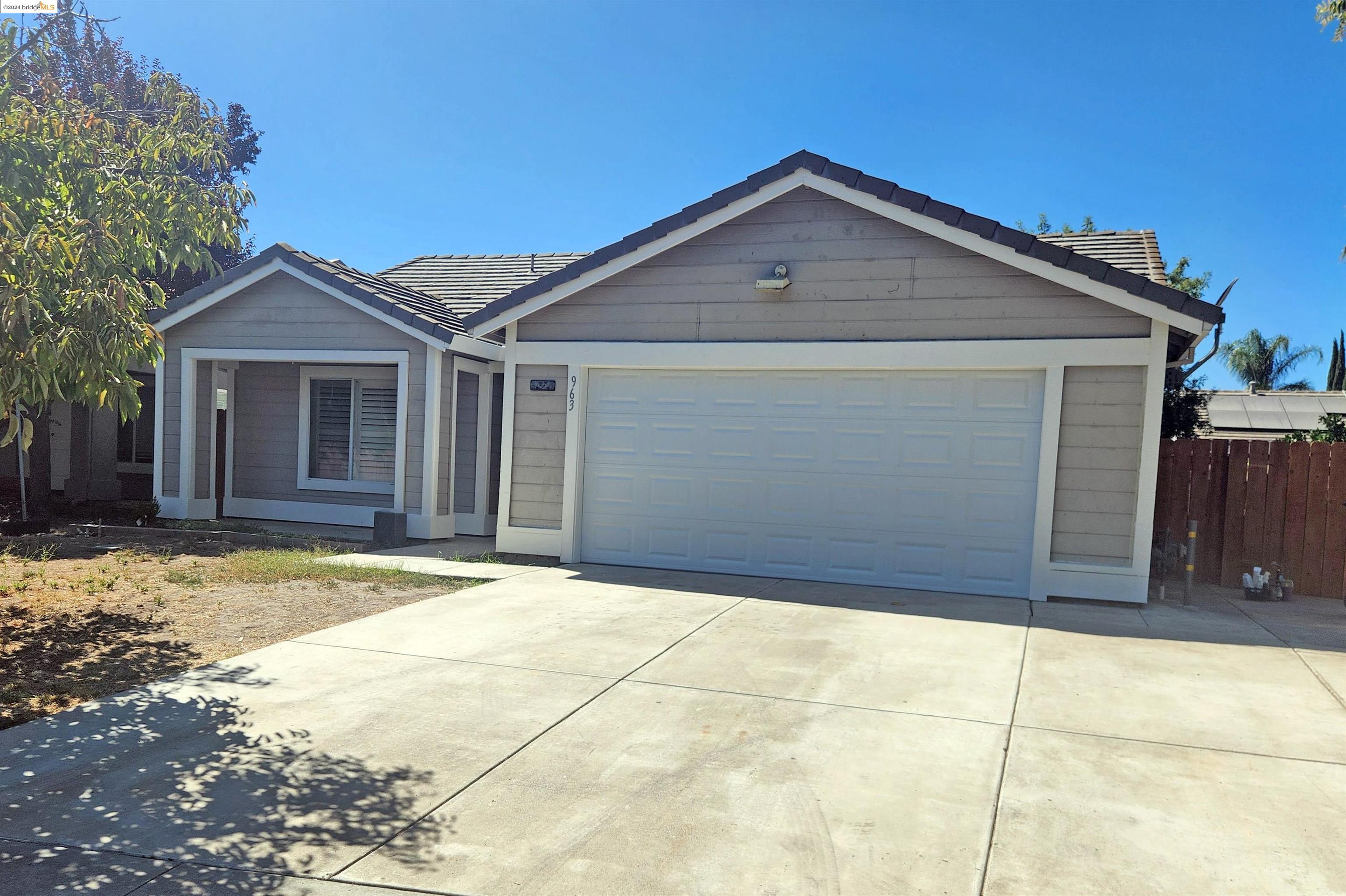 a front view of a house with a garage