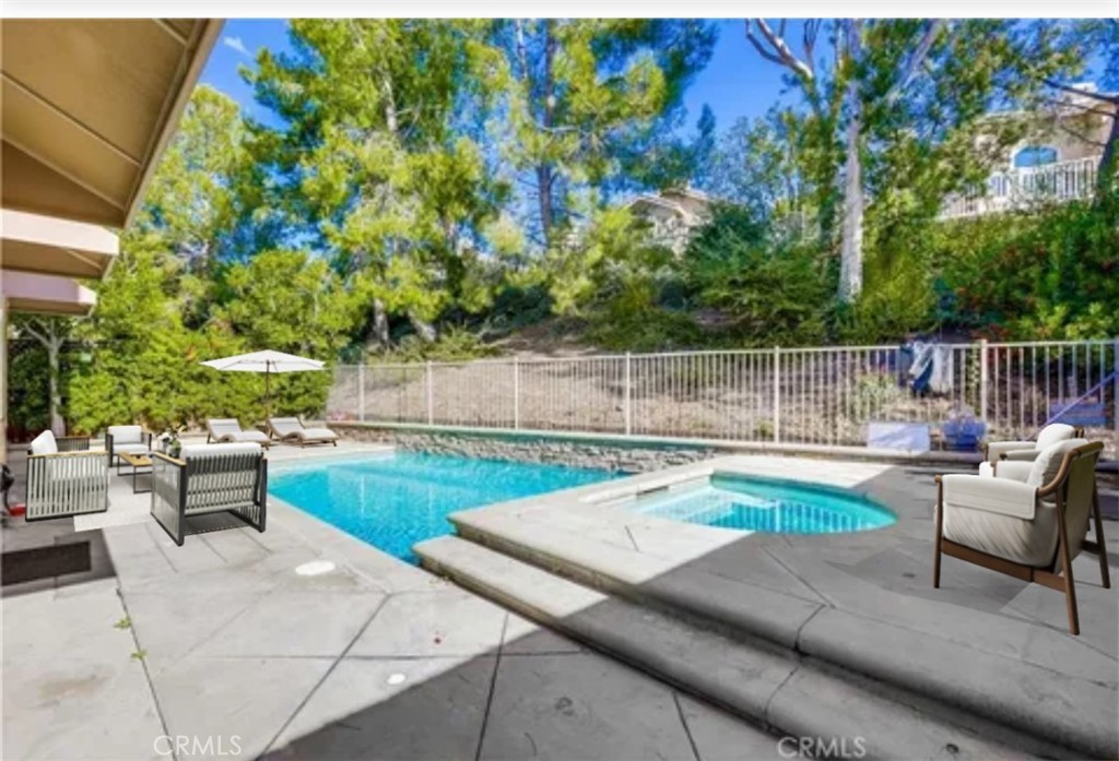 a view of backyard with seating area and green space