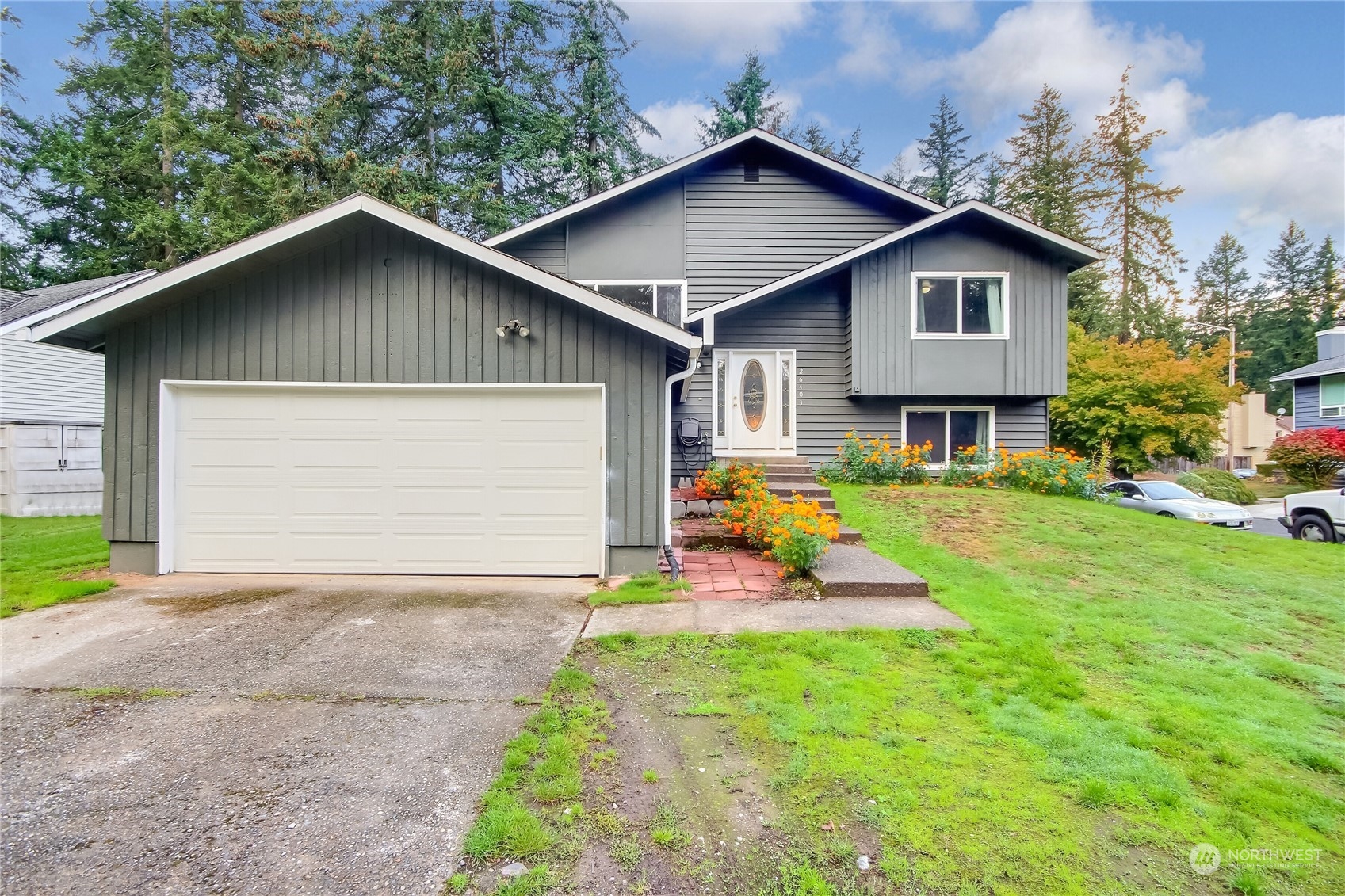 a front view of house with yard and green space