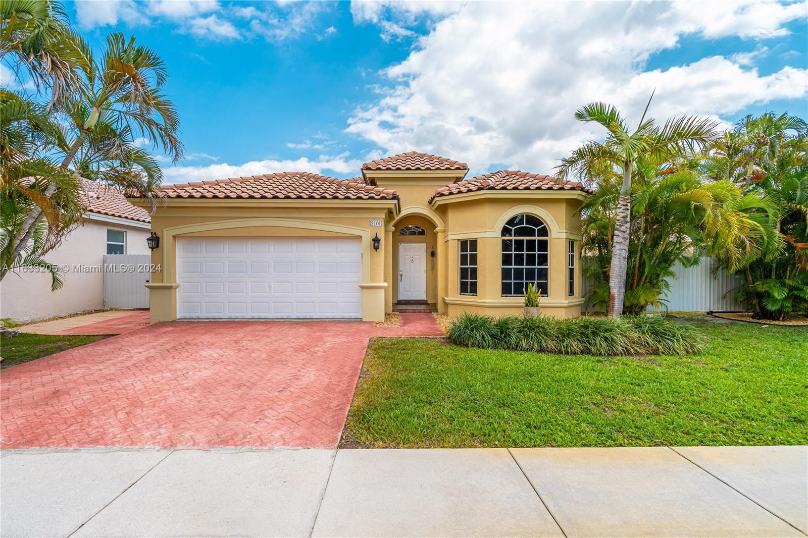 front view of a house with a yard