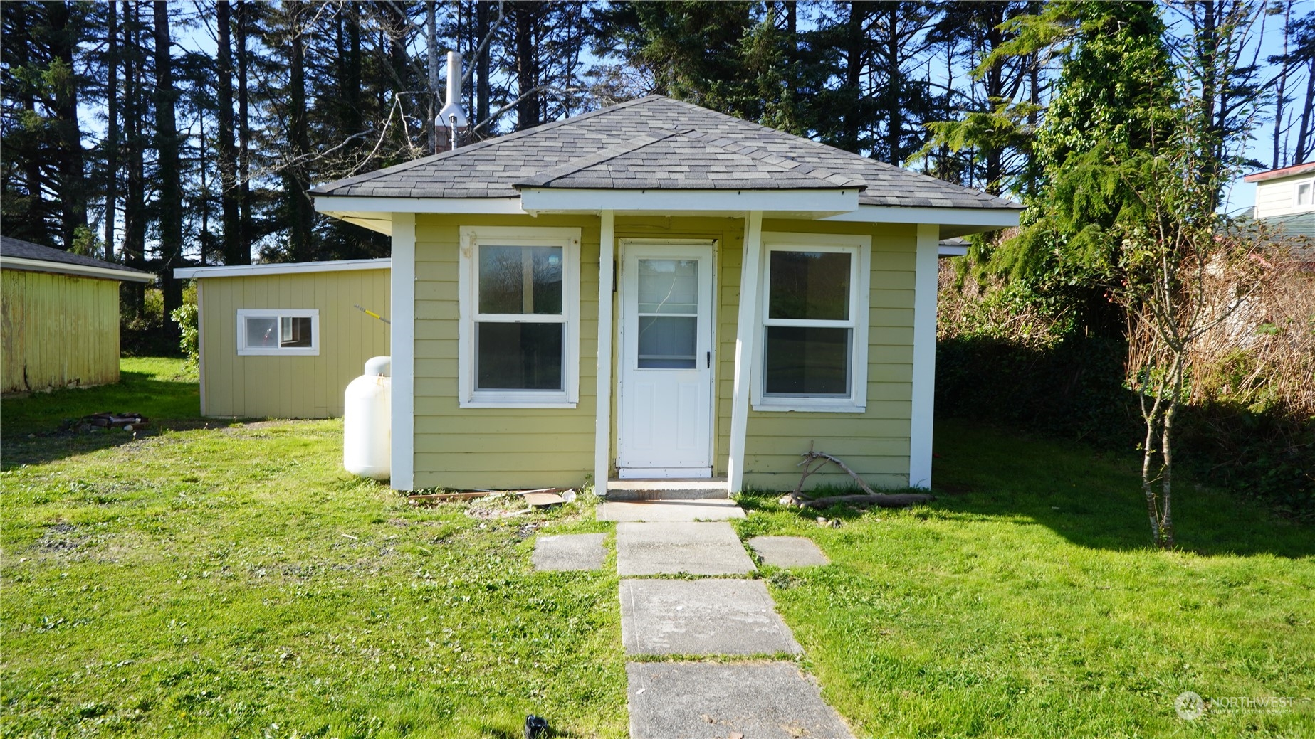 a front view of a house with garden