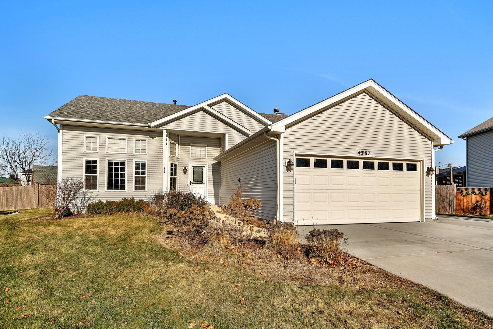 a view of house with yard