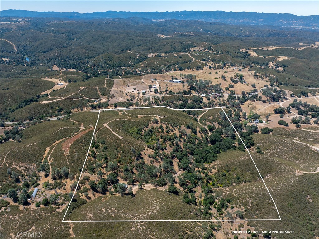 an aerial view of a houses with a yard