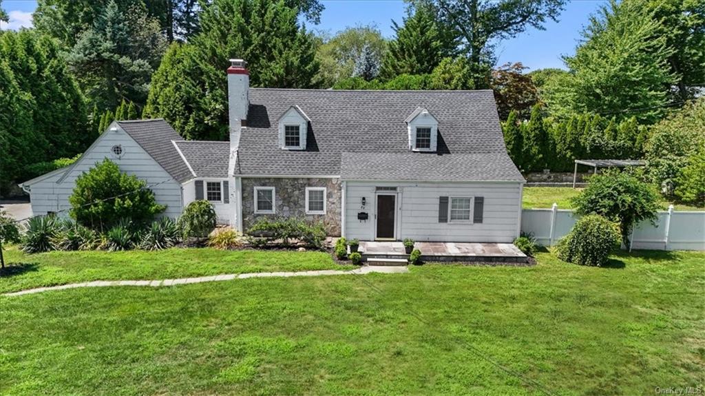 a aerial view of a house with a yard